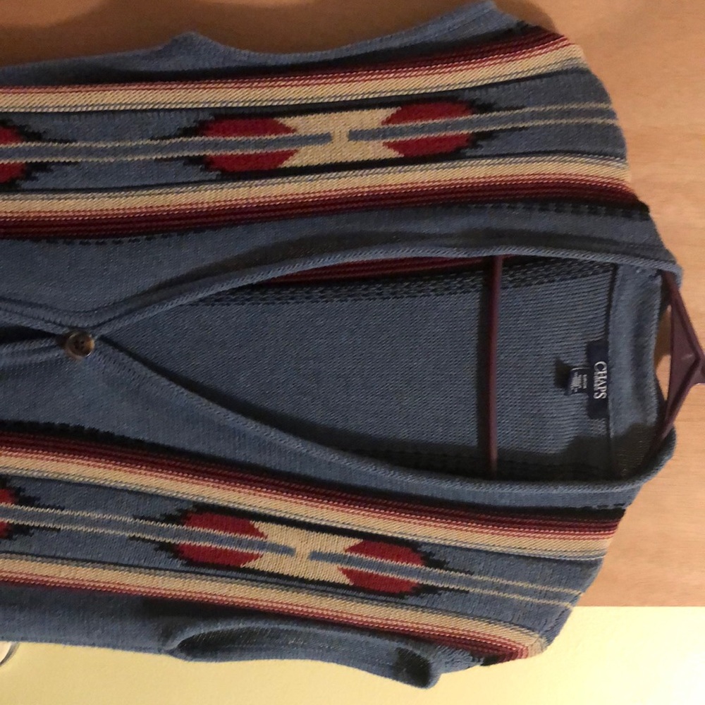 Sleeveless long sweater with pockets